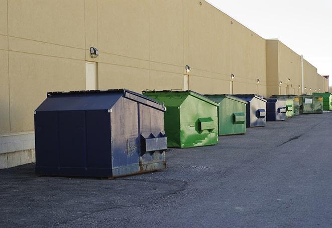 brightly colored dumpsters filled with construction waste in Bellbrook, OH